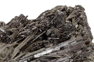 Macro stone black mineral tourmaline Scherl on white background photo