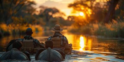 At sunset, a man wearing a hat is peacefully seated in a boat on a river photo