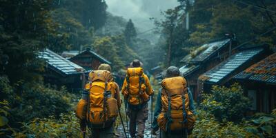 Three people wearing backpacks are hiking along a trail in the rain photo