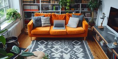 There is a laptop on the couch in the living room photo