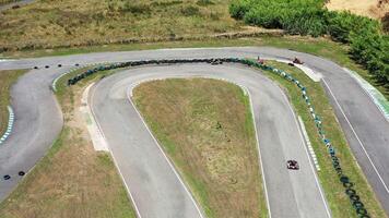 Drone capturing go-karts racing on winding tracks video