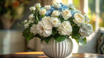 White Hydrangea Bouquet In A Striped Vase On A Table In A Modern Home photo