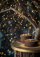 Two Chocolate Cakes With Gold Accents on Rustic Table With Twinkle Lights photo