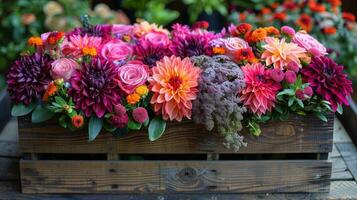 Colorful Flower Arrangement in Wooden Crate Against Dark Background photo