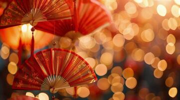 Red Paper Fans and Ornaments Decorate a Christmas Tree With Warm Bokeh Lights photo