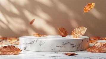 White Marble Platform With Autumn Leaves on Tan Background photo
