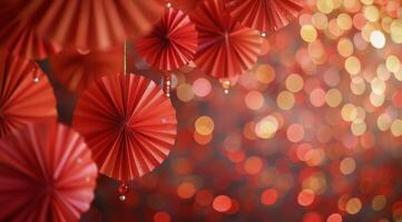 Red Folding Fans Hanging Against a Bokeh Background photo