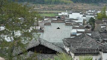 The beautiful traditional Chinese village view with the classical architecture and the narrow lane as background photo