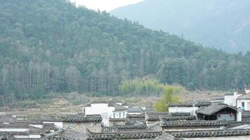 The beautiful traditional Chinese village view with the classical architecture and the narrow lane as background photo