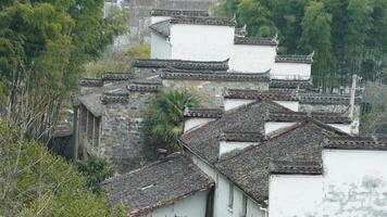 The beautiful traditional Chinese village view with the classical architecture and the narrow lane as background photo