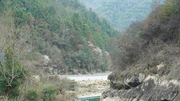 The river valley landscape with the mountains and forest as background in spring photo