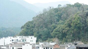 The beautiful traditional Chinese village view with the classical architecture and the narrow lane as background photo