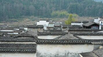 The beautiful traditional Chinese village view with the classical architecture and the narrow lane as background photo