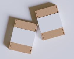Brown cardboard boxes with a label white color isolated on gray background photo