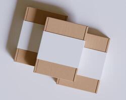 Brown cardboard boxes with a label white color isolated on gray background photo