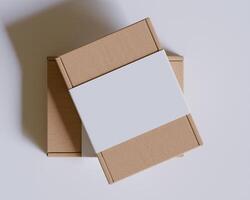 Brown cardboard boxes with a label white color isolated on gray background photo