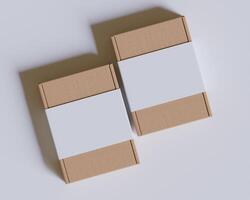 Brown cardboard boxes with a label white color isolated on gray background photo