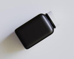 Pill square bottle black color and white cap on gray background photo