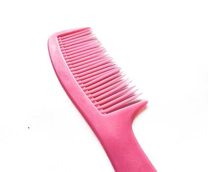 rosado pelo peine aislado en blanco antecedentes foto