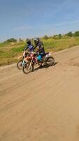 FPV of riders on a motocross track at the start of the race. video