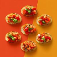 Appetizing Italian bruschetta with tomatoes and basil on colorful background. Delicious snack or appetizer for party or gathering photo