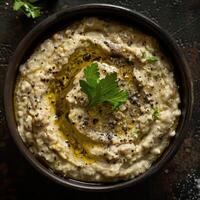 Creamy Baba ghanoush dip made with roasted eggplant, tahini, lemon juice and garlic. Middle Eastern and Mediterranean cuisine. photo