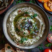 Delicious Baba Ganoush Dip with Olive Oil, Parsley, and Red Onion. Middle Eastern Cuisine, Appetizer, Recipe photo