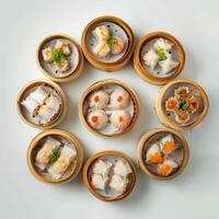 Assortment of delicious dim sum dumplings in bamboo steamer baskets. Variety of Chinese cuisine appetizers. photo