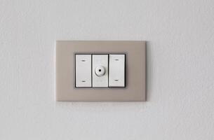 Light switch on white background, copy space photo