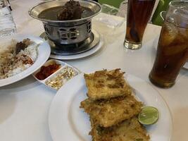 Various types of food and drinks on the restaurant table photo
