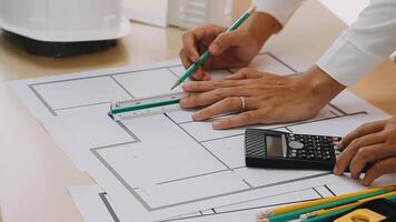 Construction and structure concept of engineer working drawing on blueprint meeting for project working with partner on model building and engineering tools in working site, construction concept video