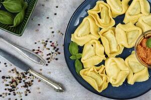 Homemade tortelloni with ricotta and spinach. photo