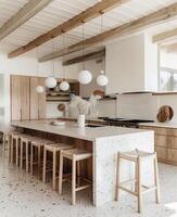 esquina de moderno cocina con blanco y de madera paredes, hormigón piso, blanco encimeras con construido en lavabo y Horno foto