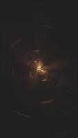 Vertical - flying through a golden light tunnel of energy particles and light beams. This sci-fi portal vortex effect motion background is full HD and a seamless loop. video