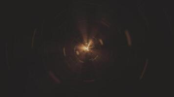 Flying through a golden light tunnel of energy particles and light beams. This sci-fi portal vortex effect motion background is full HD and a seamless loop. video