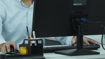 Hands of an office employee working at a computer. video