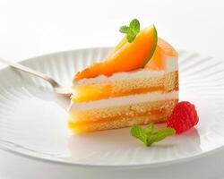 a piece of cake on a plate with a fork photo