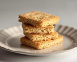a stack of shortbread cookies on a white plate photo