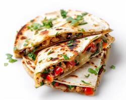 a stack of quesadillas with vegetables and cheese photo