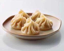 Plate with Four Dumplings on It photo