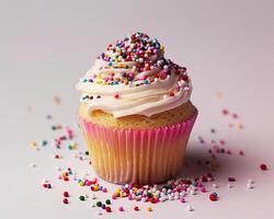 a cupcake with sprinkles on top photo
