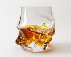 a glass of whiskey with ice in it photo