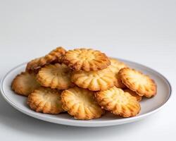 a plate of cookies on a white background photo