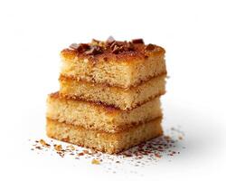 stack of three pieces of cake on a white background photo