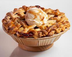 A bowl of ice cream and a pie photo