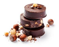 chocolate covered hazelnuts on white background photo
