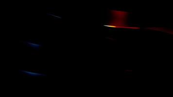 Black background with bright animation. Design. Bright ribbons that sway in different directions. video