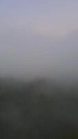 Vertical Drone Footage of fog in the mountain at Gorontalo, Indonesia video