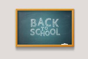 Back to School. Text and chalks on a school board with texture and wooden frame. vector