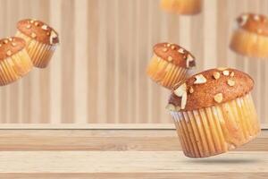Almond muffins on a wooden table with a blurred background. photo